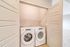 Modern apartment laundry area with sleek washer and dryer, offering convenient in-home laundry options.
