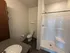 Contemporary bathroom featuring a sleek shower, modern fixtures, and stylish vanity.