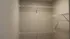 Spacious walk-in closet with ample shelving for organized storage.