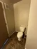 Modern bathroom featuring sleek tile flooring and a compact design, perfect for maximizing space.