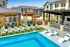 Tables with Umbrella Shade by the Pool | Altair Tech Ridge |