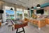 Amenity-filled Clubhouse with Tastefuly decorated lounge with comfortable seating | Altair Tech Ridge | Austin, TX Apartments