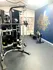 Inviting fitness center with modern exercise equipment and motivational wall art, perfect for a healthy lifestyle.