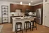 Modern kitchen with sleek cabinets, stainless steel appliances, and a stylish island with seating.