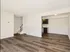 Spacious living area leading to separate dining area near kitchen. Stairs to the left take you to the second story.