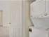 Stackable washer & dryer in laundry closet.
