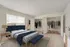 Main bedroom showing two full-length closets and huge windows with lots of natural light.