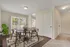 Dining area with vinyl plank flooring and spacious walk-out patio.