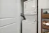 Laundry areas, concealed by closet door showing stackable washer & dryer in each apartment.
