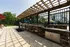 Outdoor grilling area with sink, two grills, and lots out outdoor kitchen counter space