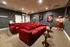 On-site theater room with two large plush couches, popcorn maker, and movie posters on the wall