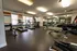 24-Hour Fitness center with rower, treadmills, cycles, stair master, free weights, and other equipment