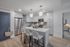 Modern kitchen with sleek cabinetry, stainless steel appliances, and a spacious island with chic pendant lighting.