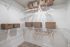 Spacious walk-in closet with organized shelving and stylish wicker baskets, perfect for elegant storage solutions.