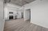 Modern, open-concept kitchen with sleek cabinetry, stainless steel appliances, and elegant wood flooring. Ideal for urban living.