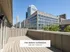Expansive townhome balcony offering stunning cityscape views of downtown skyscrapers with The Select Collection Annexe West Townhomes.