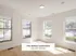 Bright and inviting room with natural light streaming through large windows, part of The Select Collection at Annex West Townhomes.