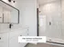 Modern bathroom featuring a sleek glass shower, elegant white vanity, and stylish lighting in The Select Collection at Annex West Townhomes.