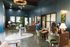 Modern and stylish office space with chic lighting, cozy seating, and vibrant decor for a welcoming atmosphere.
