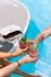 Vibrant poolside scene with friends toasting refreshing cocktails next to a delicious pizza box, creating the perfect summer vibe.