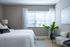 Main Street apartment bedroom with large window