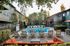 Pet-Friendly Apartments In Concord - Diablo View & Villa Diablo - Partially Shaded Lounge Area By The Pool With Plenty Of Seating, Tables, Trees, And Landscaping.