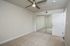 One And Two-BR Apartments In Concord, CA - Diablo View & Villa Diablo - Updated Bedroom With Mirrored Sliding Closet Doors, Wood-Style Flooring, Furniture, Open Doorway To Common Area, And Plenty Of Natural Light