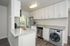 Apartments for Rent in Concord, CA - Diablo View & Villa Diablo - Kitchen with Vinyl Flooring, Granite Countertops, White Cabinets, Stainless Steel Appliances, and a Washer