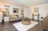 Dog-Friendly Apartments in Concord, CA - Diablo View and Villa Diablo - Spacious Living Room with Wood Flooring, a Beige Sofa, Rug, Large, Round Coffee Table, wooden Desk, Lamps, Mounted Mirrors, and White Walls