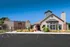 Front of the apartment leasing office with handicap parking space and accessible sidewalk