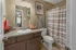 Private bathroom featuring linen closet
