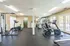 Fully equipped fitness center at Raiders Walk with a variety of exercise machines and free weights