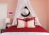 1810 The Social, interior, bedroom, white, red and pink decor, bed, wall art, desk and chair, bed curtain, laimp