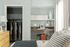 1810 The Social, interior, bedroom, grays and whites, wood dresser, bed, desk and chair, closet, large window