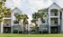 1800 The Ivy, exterior, white and gray buildings, three levels, balconies, palm trees, grass, cars