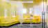 1800 The Ivy, interior, black and white carpet, large windows, glass doors, yellow walls and sectional