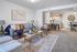Stylish living room with modern decor and open kitchen layout.