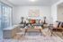 Bright, modern living room with cozy sofa, stylish coffee table, and soft lighting.