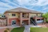 Inviting residential clubhouse with modern architecture, featuring a laundry facility and office space, beautifully set against a vibrant landscape.