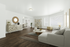 Bright and modern living room with sleek hardwood floors, chic beige sofa, contemporary decor, and ample natural light.