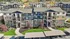 Charming apartment complex with modern design, stone accents, and lush landscaping, offering serene suburban living. | Triton Terrace | Apartments Draper, Utah