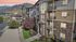 Charming apartment complex set against stunning mountain views at sunset, featuring modern architecture and lush landscaping. | Triton Terrace | Apartments Draper, Utah