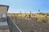 Inviting outdoor dog park adjacent to a modern apartment, featuring agility equipment and scenic hillside views. | Triton Terrace | Apartments Draper, Utah