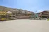 Contemporary apartment complex with scenic hill views, featuring a basketball court, colorful playground, and inviting outdoor spaces. | Triton Terrace | Apartments Draper, Utah