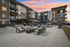 Luxurious modern apartment complex with elegant outdoor seating and a cozy fire pit under a stunning sunset sky. | Point of View | Apartments in Draper, Utah