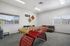 Bright and spacious game room featuring a vibrant foosball table and cozy seating, perfect for relaxation and entertainment.
