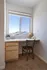 Bright and inviting study nook with natural light, featuring a sleek desk and cozy chair, perfect for productivity.