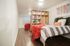 Sparq-on-Rio-Apartments-Near-UT-Austin-Bedroom-with-Hardwood-Style-Flooring