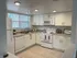 Updated Kitchen w/white cabinets and appliances