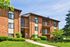 Caton House Apts; Exterior, 3 story apt building, balconies, patios, manicured lawn, controlled building access, trees, shrubs
